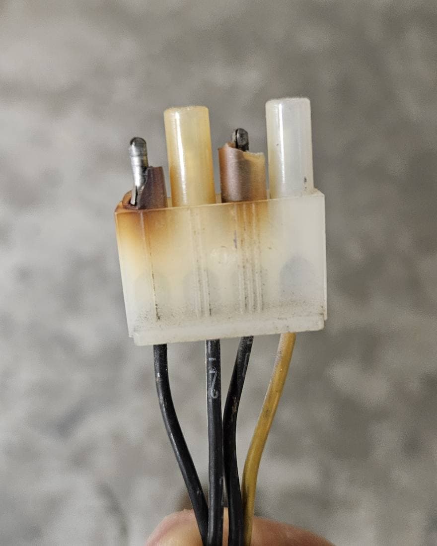 Heat-scorched connector housing with discolored terminals from a heater circuit